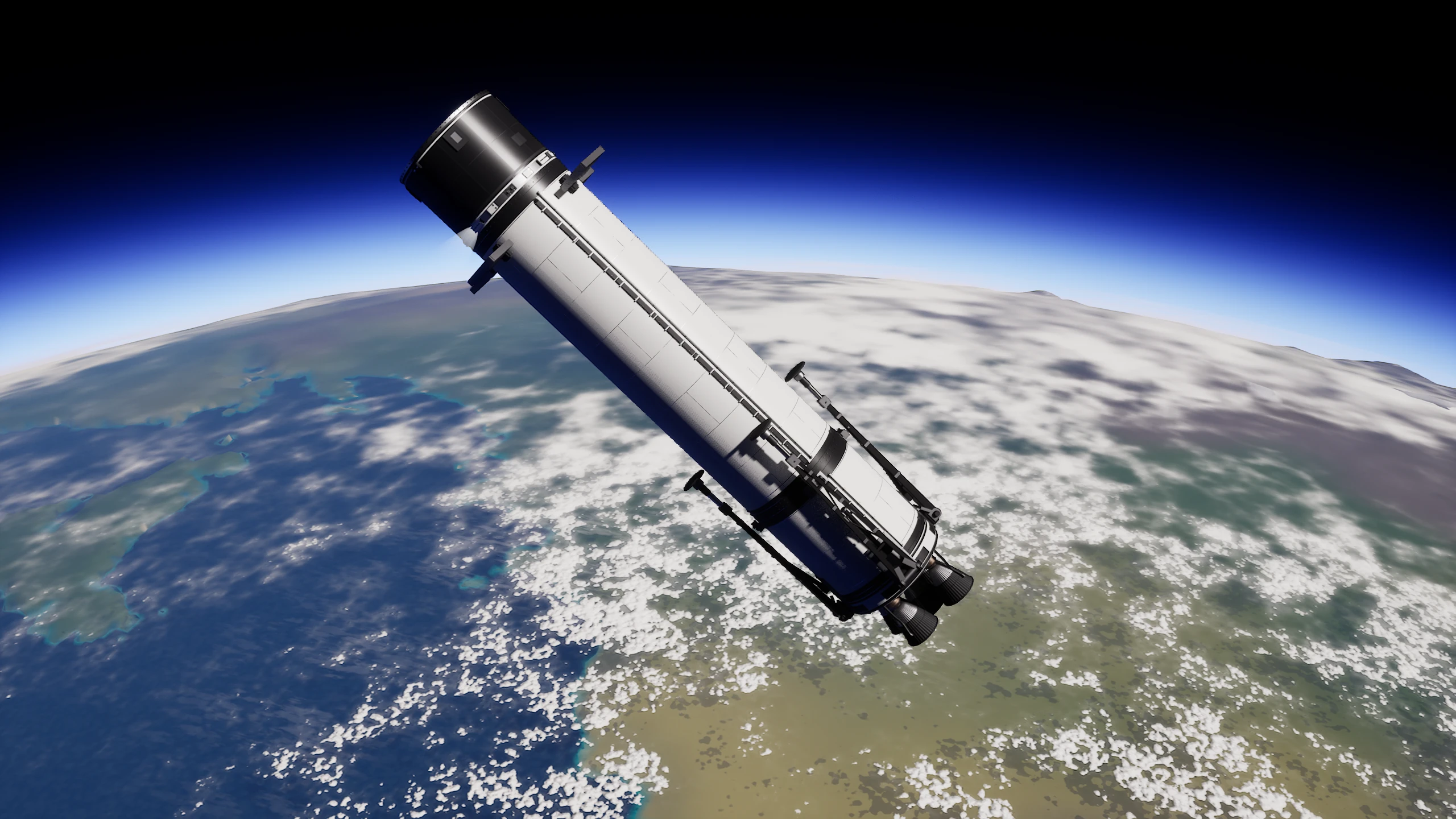 A returning booster above Terra with deployed grid fins
